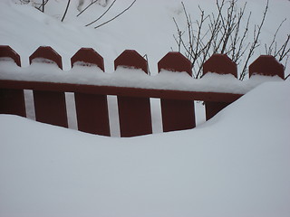 Image showing Red fence in the snow