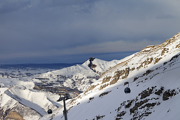 Image showing Gondola lift on ski resort at sun evening