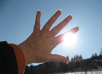 Image showing Try to block the sun