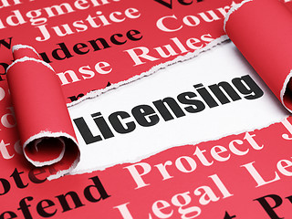 Image showing Law concept: black text Licensing under the piece of  torn paper