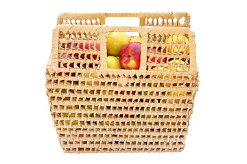 Image showing wicker basket full of colorful apples