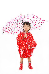 Image showing Chinese Little Girl Holding umbrella with raincoat