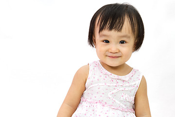 Image showing Chinese Little Girl Smiles for a portrait in studio