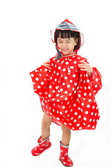 Image showing Chinese Little Girl Wearing raincoat and Boots