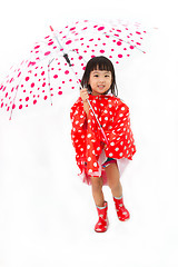 Image showing Chinese Little Girl Holding umbrella with raincoat