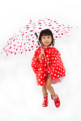 Image showing Chinese Little Girl Holding umbrella with raincoat