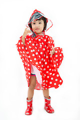 Image showing Chinese Little Girl Wearing raincoat and Boots