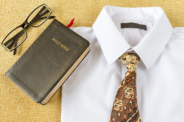 Image showing business man style clothes and Holy Bible at home