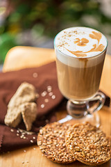 Image showing coffee latte cup with cookies