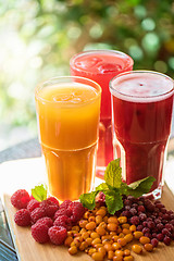Image showing fruit drink with cranberries raspberries and sea buckthorn