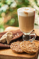 Image showing coffee latte cup with cookies