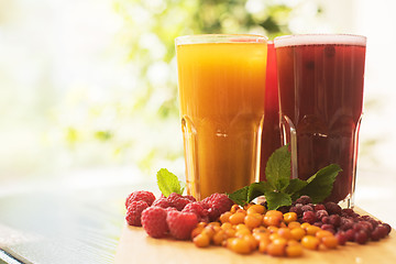 Image showing fruit drink with cranberries raspberries and sea buckthorn