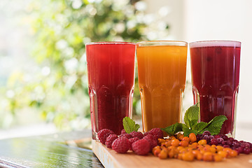 Image showing fruit drink with cranberries raspberries and sea buckthorn