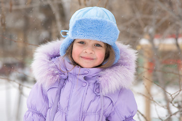 Image showing Portrait of a Girl in snowy winter weather