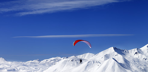 Image showing Panoramic view on sky gliding in snowy mountains at nice sun day