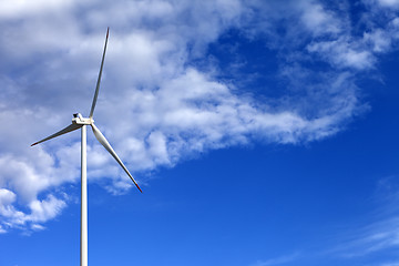 Image showing Wind turbine and blue sunlight sky