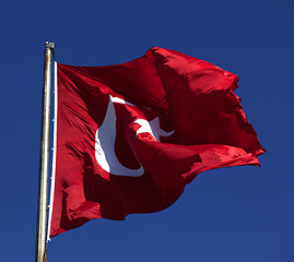 Image showing Sunlight Turkish flag waving in wind at sunny day