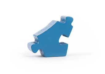 Image showing Closeup of big blue jigsaw puzzle piece