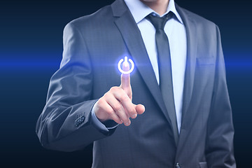 Image showing Businessman pressing power button concept