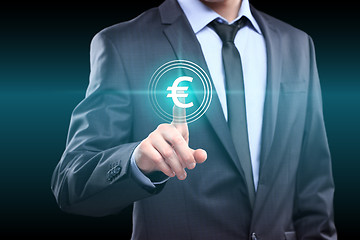 Image showing business, technology, networking concept - businessman pressing euro button on virtual screens
