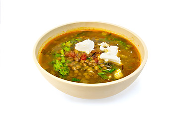 Image showing Soup lentil with spinach and cheese in yellow bowl