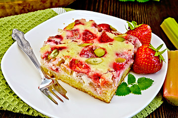 Image showing Pie strawberry-rhubarb with sour cream on dark board