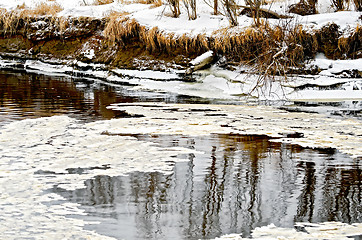 Image showing Ice in water and snow on the shore