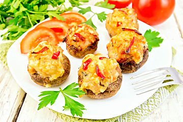 Image showing Champignons stuffed meat in white plate on green napkin