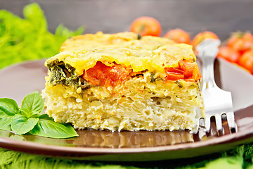 Image showing Pie potato with tomato and cheese on board