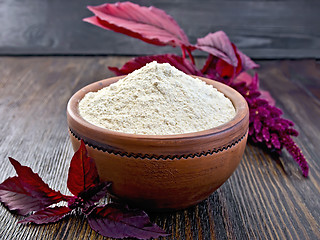 Image showing Flour amaranth in clay bowl on dark board