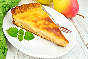 Image showing Pie pear with sour cream on board