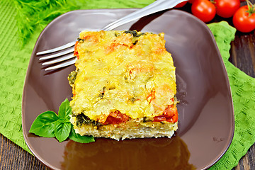 Image showing Pie potato with tomato on dark board