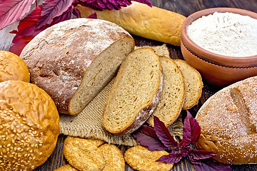 Image showing Bread and biscuits amaranth with flour and flower on board