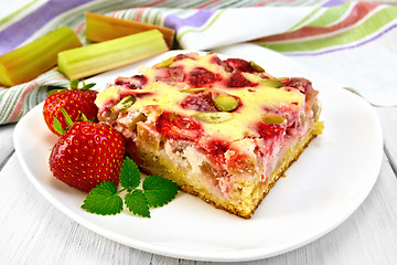 Image showing Pie strawberry-rhubarb with sour cream and mint on board