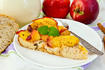 Image showing Pudding from bread and peaches with milk on light board