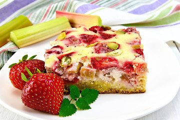 Image showing Pie strawberry-rhubarb with sour cream and napkin on board