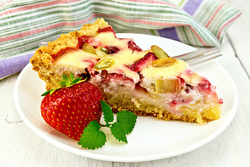 Image showing Pie strawberry-rhubarb with sour cream and berries on board