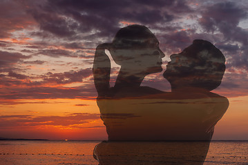 Image showing Romantic couple on the beach at colorful sunset 