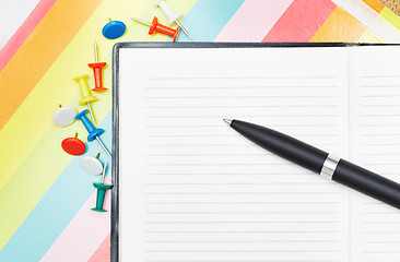 Image showing Notepad with pen and pushpins