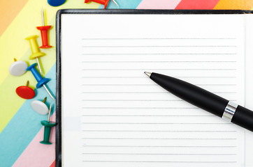 Image showing Notepad with pen and pushpins