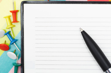 Image showing Notepad with pen and pushpins