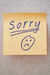 Image showing Sorry written on a sticky note