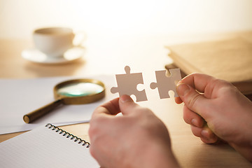 Image showing Building a business success. The hands with puzzles