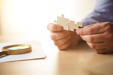 Image showing Building a business success. The hands with puzzles