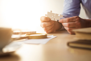 Image showing Building a business success. The hands with puzzles