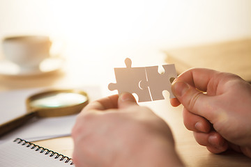 Image showing Building a business success. The hands with puzzles