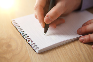 Image showing The male hand with a pen 