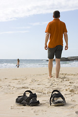 Image showing Man barefoot on beach