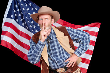 Image showing Hushing senior cowboy with American flag