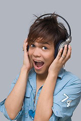 Image showing Cheering boy with headphones